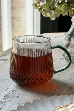 Vaso De Cristal Con Detalles Tallados Y Asa De Color